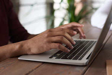 Cursos Person Using Macbook